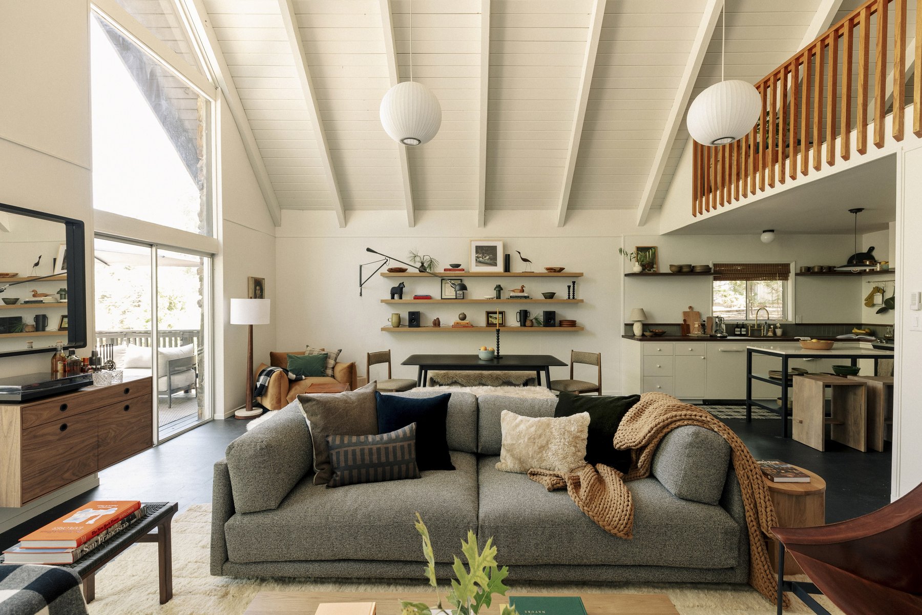 Open living, dining, and kitchen area in the Yosemite home with vaulted ceilings